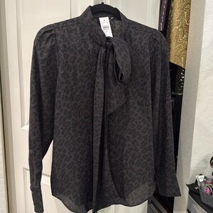 Woman’s cheetah print blouse